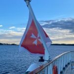 NOK-sonnenaufgang-mit-Flagge-Malta-225x300-2.jpg